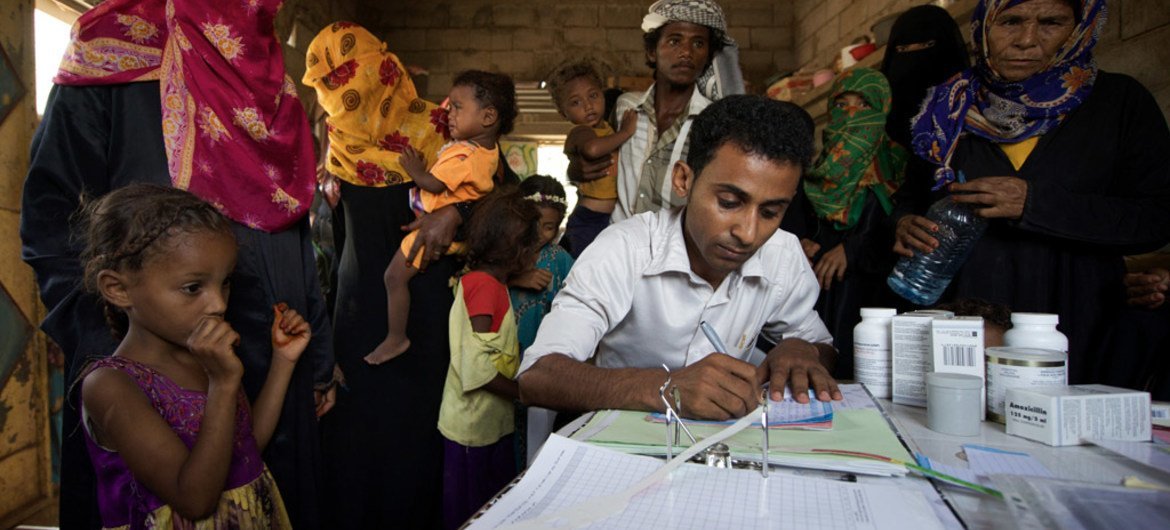A medical worker registers young patients in the small rural village of An-Nassiri, located about 60 km from Al Hudaydah, Yemen. Only 45 per cent of health facilities in the war-torn country are currently functioning.