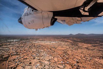 On a UN Humanitarian Air Services (UNHAS) aircraft before landing in Dinsoor, central Somalia.