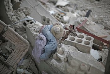 A child's plush toy lies in the rubble of a destroyed building in rural Damascus, Syria. (File)