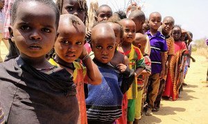 Children lining up for their one meal per day at a school in Bandarero, Northern Kenya.