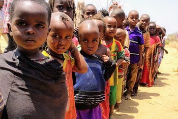 Children lining up for their one meal per day at a school in Bandarero, Northern Kenya.