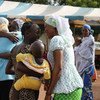 At the Transitional Center in Bamako, Mali, returnees are welcomed by their relatives and friends.