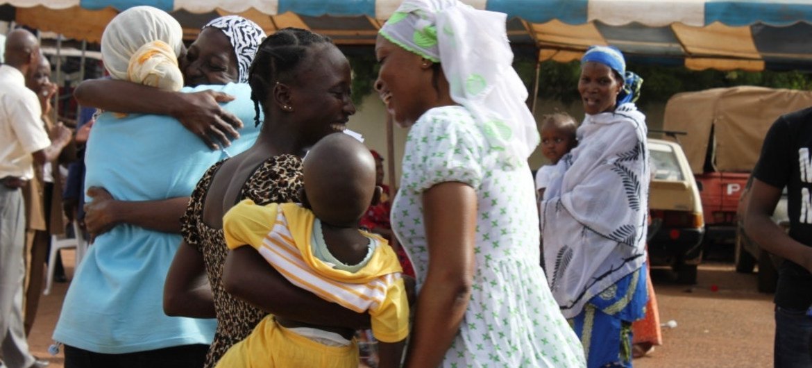 At the Transitional Center in Bamako, Mali, returnees are welcomed by their relatives and friends.