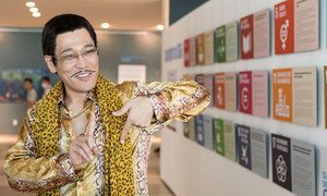 Piko Taro shows his 17 (Goals) sign in front of ‘Spotlight on SDGs’ photo exhibition on 17 July 2017 at United Nations Headquarters in New York.
