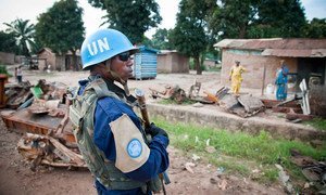 A Police Commissioner joins the first patrol by MINUSCA in Bangui, capital of the Central African Republic .