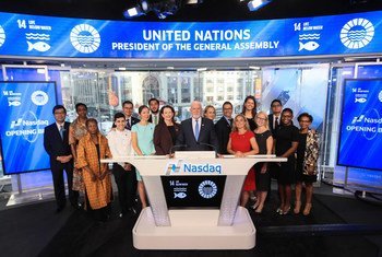 Peter Thomson, President of the 71st Session of the United Nations General Assembly (at podium), rings the Nasdaq Opening Bell.