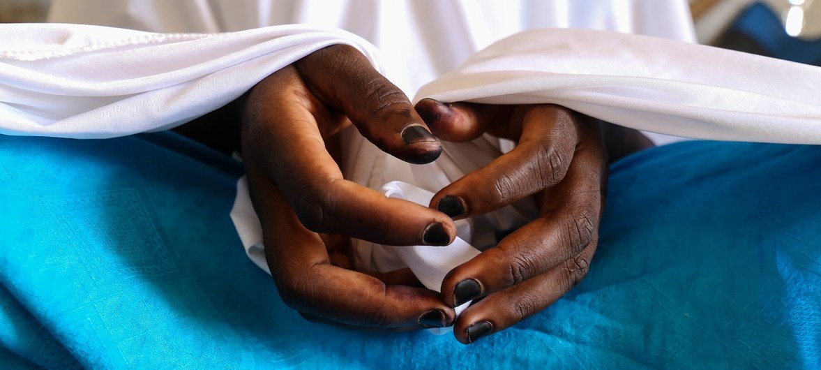 A file photo of a 17-year-old girl, ‘Aminata,’ who was forced to live with Boko Haram for two years, sitting in an internally displaced persons camp in north-east Nigeria.