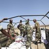 Foodstuff being loaded onto a truck at Baidoa Airport. It is part of the support that UNSOM will be giving to SNA soldiers as they fight alongside AMISOM troops. AU/UNISTPHOTO /Mohamed Guled