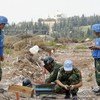 A United Nations Chinese battalion involved in the demining of the town of Hiniyah in Lebanon prepares to detonate unexploded ordnance.