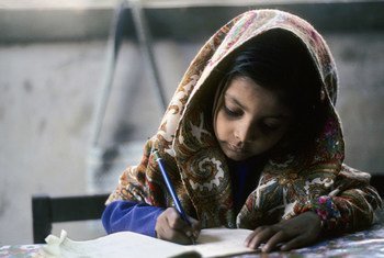 A young girl does her school work in Karachi, Pakistan.