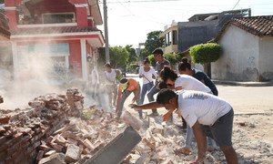 In Oaxaca, Mexico, volunteers from San Blas Atempa help remove debris and clear the streets of San Mateo del Mar affected by the earthquake.