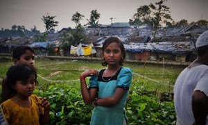 Rohingya refugee children from Myanmar stand outside Kutupalong camp in Bangladesh (July 2017).