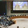 A wide view of the Security Council Chamber as Michael Keating (left on screen), Special Representative of the Secretary-General and Head of the UN Assistance Mission in Somalia (UNSOM), briefs the Council via video link.