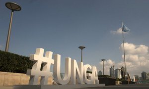 A sign outside the UN General Assembly building highlights the hashtag for attendees to use to promote the general debate.