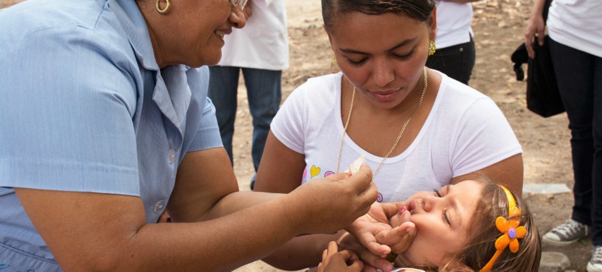 A child in Honduras being dewormed.