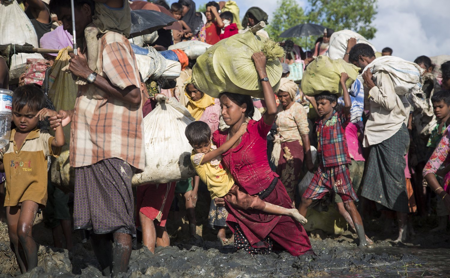 Thousands of new Rohingya refugee arrivals cross the border near Anzuman Para village, Palong Khali, Bangladesh.