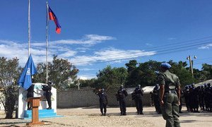 The UN flag is raised at the opening ceremony for the new United Nations Mission for Justice Support in Haiti (MINUJUSTH).