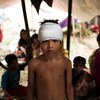 8岁男孩亚新是居住在考克斯巴扎地区简易营地中的罗兴亚难民的一员。联合国儿基会/Brown