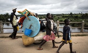 A family flee violence in Kamonia, Kasai province, Democratic Republic of the Congo.