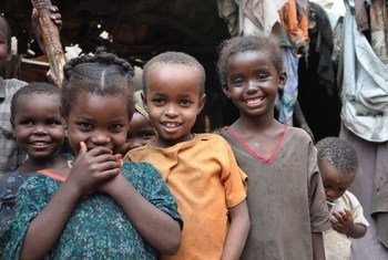 Three sisters, ranging in age from two to five years old, and their friends are at a camp in Galkayo, Somalia, waiting to be vaccinated. Along with education support, UNICEF is also supporting polio and measles vaccine programmes in the camp.