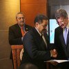 Miroslav Laj&#269;ák, the President of the General Assembly (right), receives the outcome communique from Hashim Hussein, the head of the UNIDO ITPO-Bahrain and Executive Secretary of WEIF 2017 (centre), as Samir Aldarabi, Director of UNIC-Manama looks on