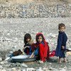 Young girls washing clothes near a small stream at the Gulan camp in the south-eastern Afghan province of Khost. Water scarcity for domestic use is one of the major issues camp residents face. Photo UNAMA/Sayed Muhammad Shah (file)