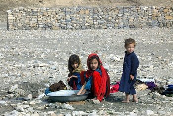 Young girls washing clothes near a small stream at the Gulan camp in the south-eastern Afghan province of Khost. Water scarcity for domestic use is one of the major issues camp residents face. Photo UNAMA/Sayed Muhammad Shah (file)