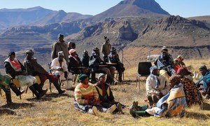 Women and men members from a local community in Lesotho participate in consultations to develop district plans to address climate change impacts and food insecurity. (file)