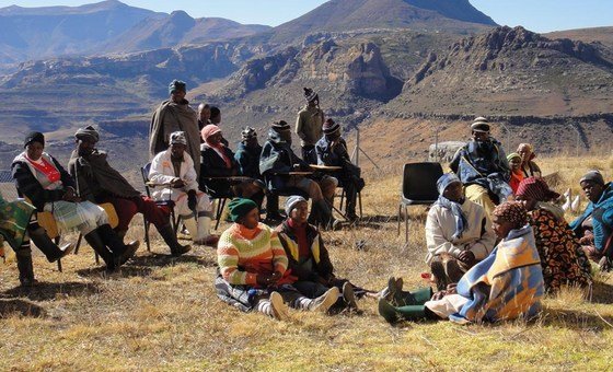 Women and men members from a local community in Lesotho participate in consultations to develop district plans to address climate change impacts and food insecurity. (file)