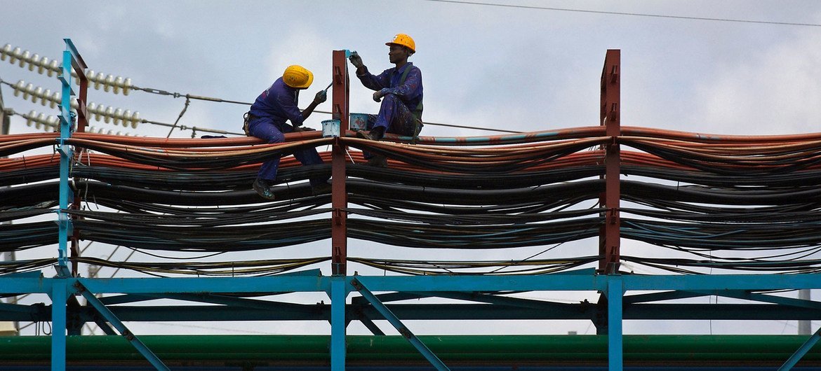 Workers maintain the thermal power station at Takoradi, Ghana (file).