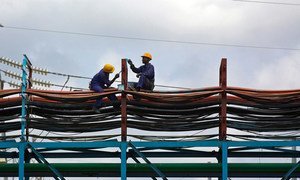 Workers maintain the thermal power station at Takoradi, Ghana (file).