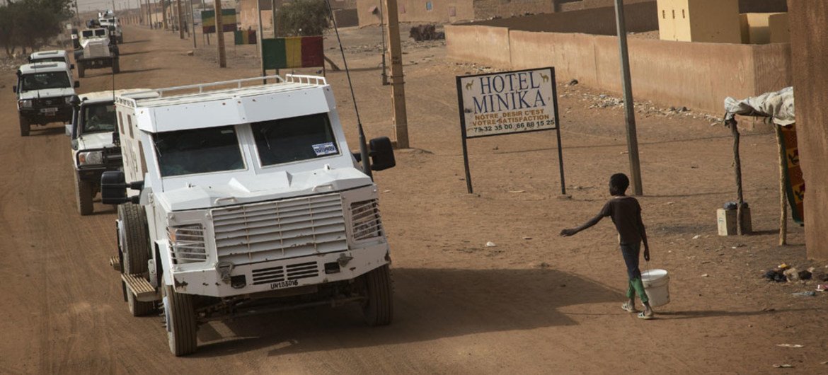 A convoy of MINUSMA vehicles drives through the streets of Menaka in northern Mali.