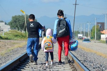 Maria [name changed], 16 (on right), from Honduras travels north with her younger siblings, expecting to cross the border near Tultitlan, Mexico, to the United States, to reunite with her family.