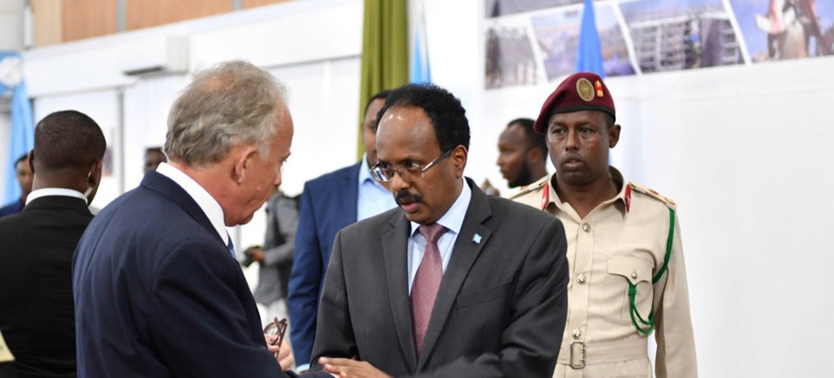 UN Special Representative of the UN Secretary-General for Somalia, Michael Keating (left), greets Somalia’s Federal President Mohamed Abdullahi Mohamed 'Farmaajo,' during the Somalia Security Conference being held in Mogadishu.
