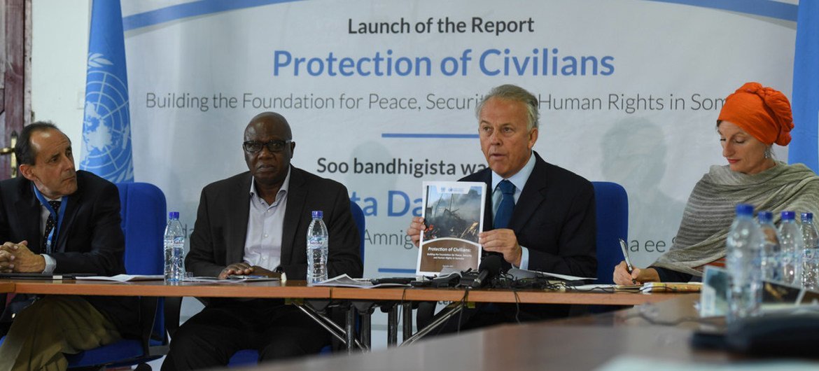 Michael Keating (second from right), the Special Representative of the UN Secretary-General (SRSG) for Somalia, addresses journalists during a press conference on the release of a UN Report on the Protection of Civilians in Somalia. The report was release