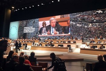 Secretary-General António Guterres (on screen) addresses the One Planet Summit in Paris.