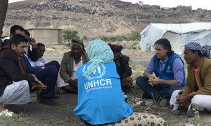 UNHCR staff consult with community leaders and local authorities in the Dharawan settlement for internally displaced people in the outskirts of Sana’a, Yemen.
