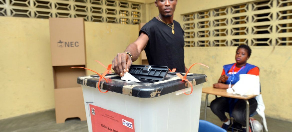 A voter in Liberia casting his ballot for a president in the second round of vote on 26 December 2017.
