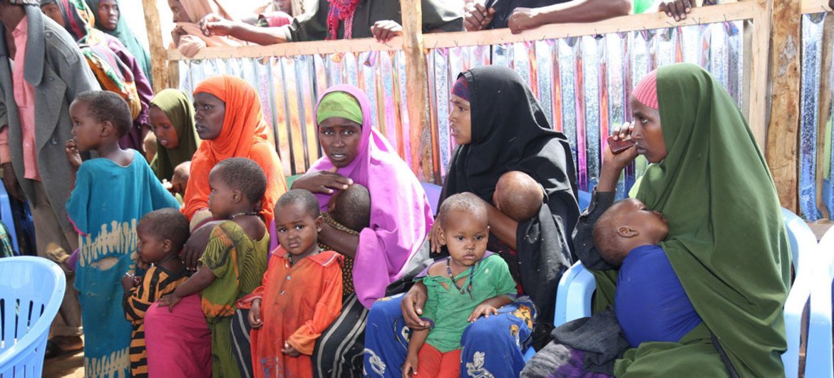 Mothers and their children in a queue waiting to receive measles vaccinations as part of a UNICEF-supported immunization campaign at the Beerta Muuri camp for internally displaced persons in Baidoa, Somalia (file).