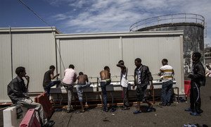 Somali and Eritrean refugees wash at a reception centre at the port of Augusta, Sicily. They had been rescued at sea by the Spanish Coast Guard after setting out from Libya. (file)