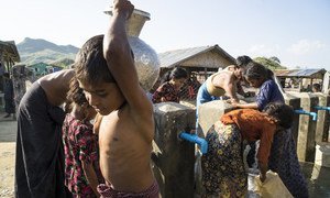 Children collect clean and safe water from a tap stand in Kyein Ni Pyin camp, home to almost 6,000 Rohingya displaced by violence in Myanmar’s Rakhine state in 2012.