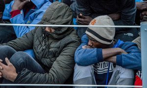 Des migrants secourus à bord d'un navire des garde-côtes libyens. Photo OIM Libye/Eshaebi/2018