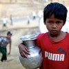 A seven-year-old Rohingya girl carries a pot of water to her family’s makeshift shelter after filling it at a hand operated water pump at the Bormapara makeshift settlement in Ukhia, Cox’s Bazar, Bangladesh.