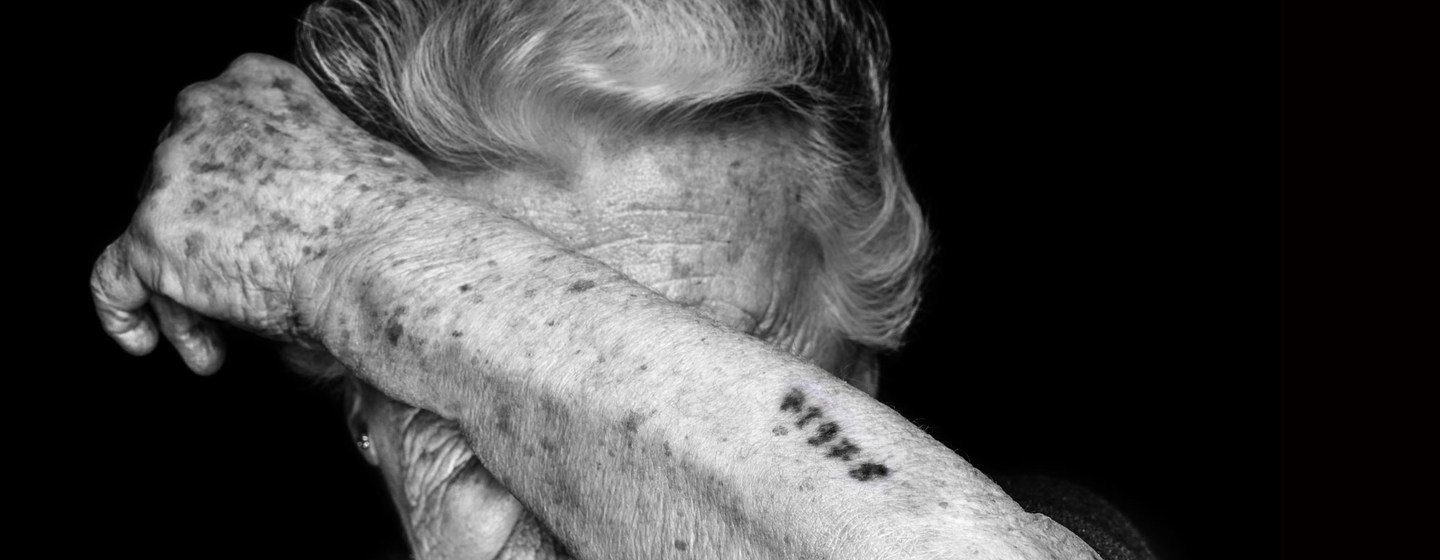 One gesture, one story: Nina Weil survived the Theresienstadt and Auschwitz concentration camps. She was tattooed with the number 71978.