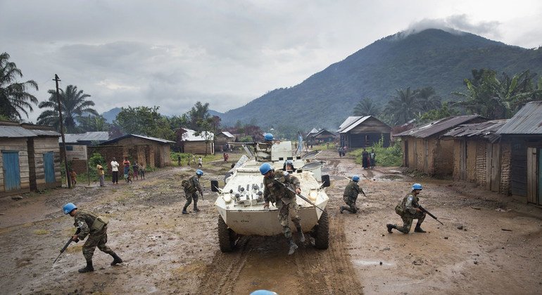 Uruguayan peacekeepers serving in the DRC patrol the town of Pinga to secure the area after the withdrawal of a militia group in December 2013.