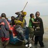 刚果（金）流离失所者抵达联合国难民署位于乌干达的一处应急中心。刚果（金）东部持续发生武装袭击，导致百姓流离失所。