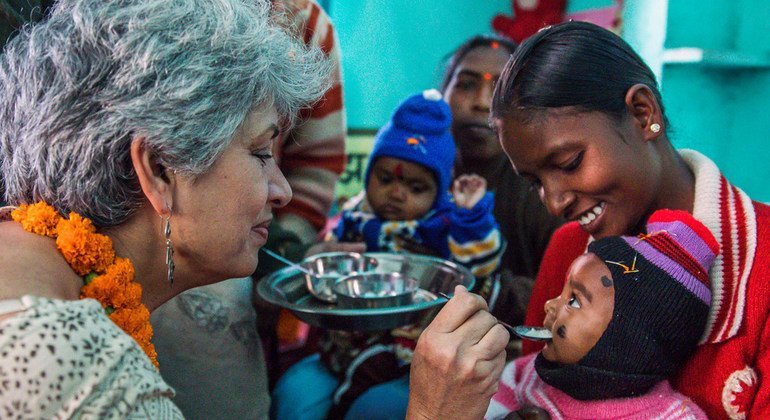 Dr. Yasmin Ali Haque, UNICEF Representative in India, feeds a child at the Anganwadi Children’s centre in Gandhigram Village, in Jharkhand State, India, on 22nd November 2017.