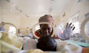 Await Said looks at her newborn grandson Ayah, who suffers from jaundice and sepsis and weighs only 1.3 kilograms, as he lies in an incubator at the Juba Teaching Hospital, Juba, South Sudan, in January 2018.