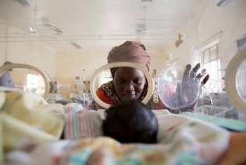 Await Said looks at her newborn grandson Ayah, who suffers from jaundice and sepsis and weighs only 1.3 kilograms, as he lies in an incubator at the Juba Teaching Hospital, Juba, South Sudan, in January 2018.
