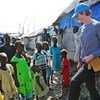 Caption: Lt. Col. Katie Hislop, the first female contingent commander to serve with the UN Mission in South Sudan (UNMISS), greets children in the Bentiu Protection of Civilians site. 